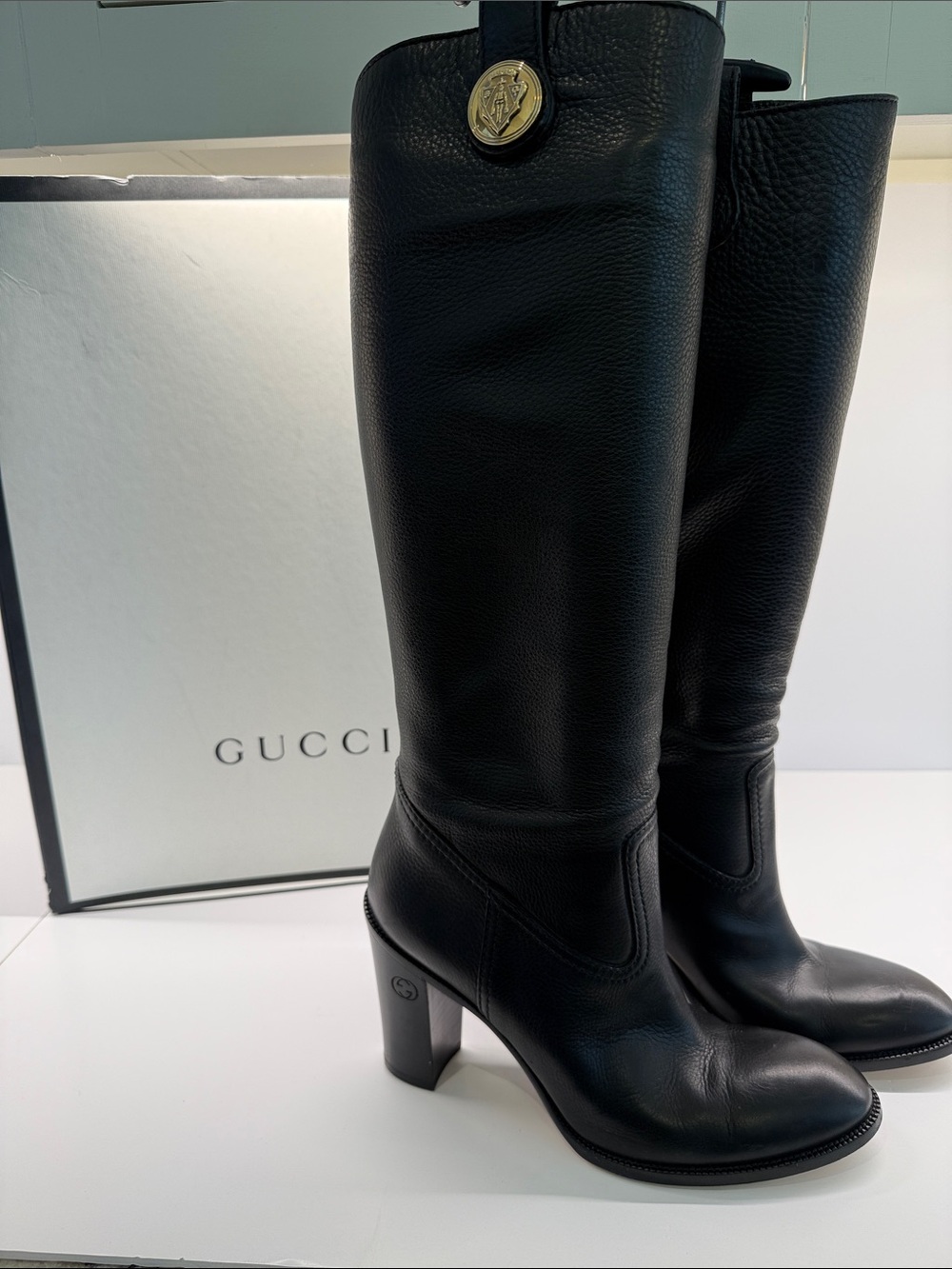 Gucci Black Pebbled Leather Knee-High Block Heel Boots with Gold Medallion